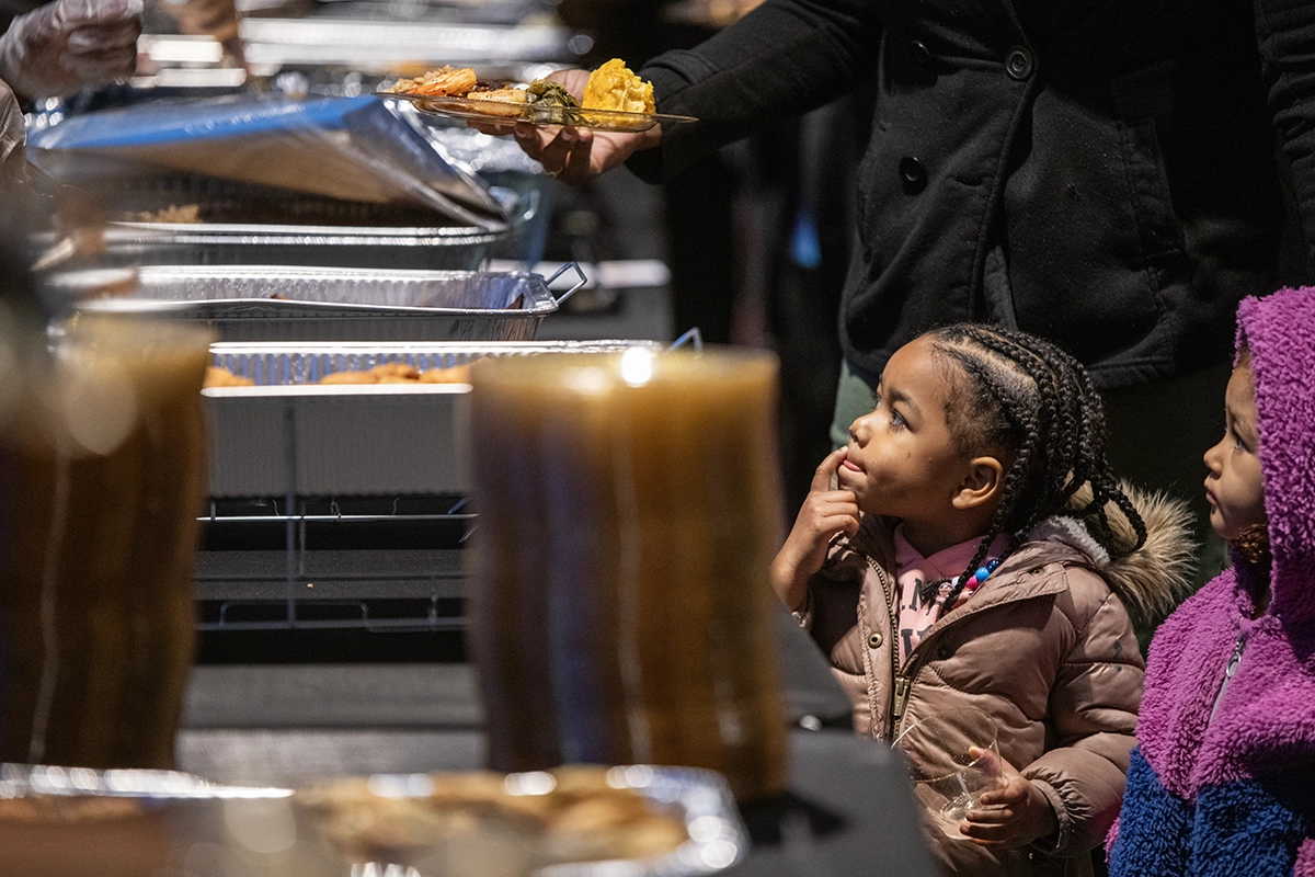 People grabbing food