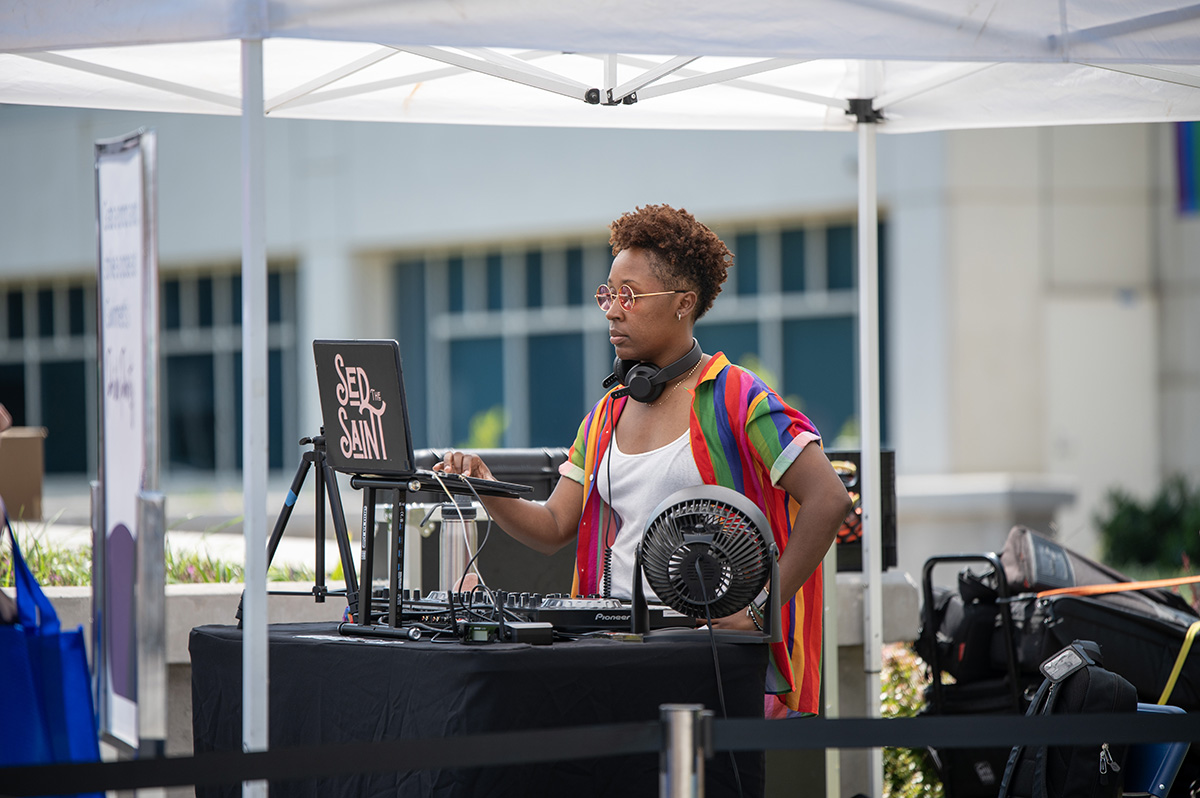 DJ playing music at the Pride Month Celebration