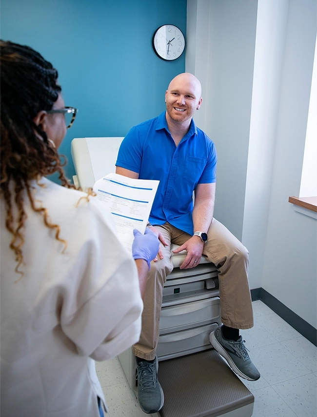 Man getting his medical physical at a clinic